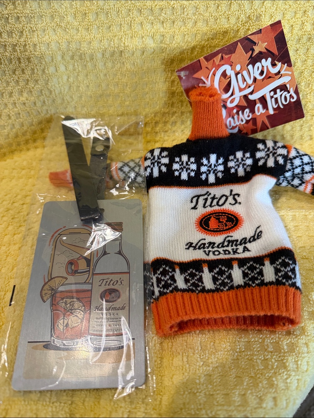 Tito's Handmade Vodka Luggage Tag with adorable bottle sweater.